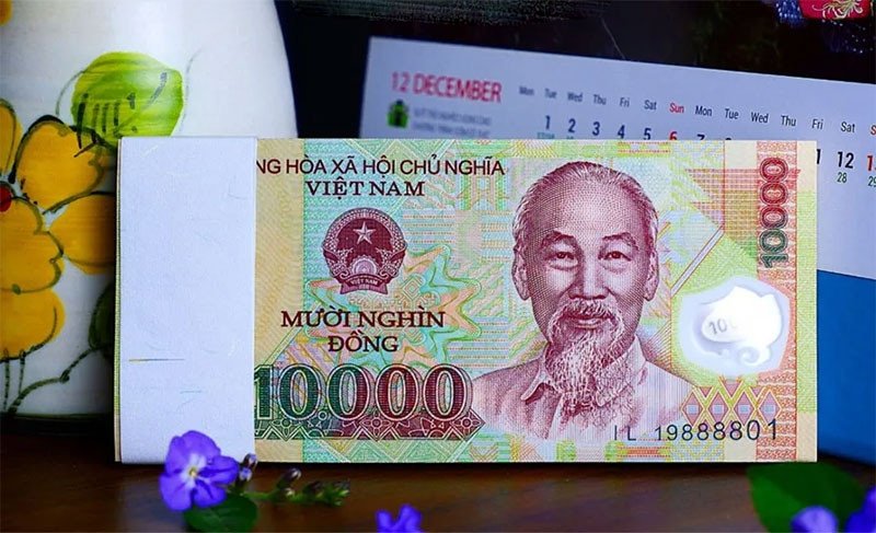 Tiền giấy 10 nghìn đồng minh họa giá trị của 1 xị trong giao tiếp hàng ngày